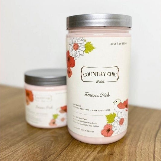 A 32oz jar of Country Chic Paint All-in-one chalk based paint in the color Forever Pink. Soft baby pink.
