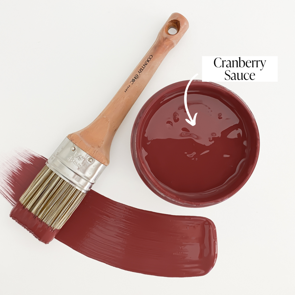 Top view of an open 16oz jar of Country Chic Chalk Style All-In-One Paint in the color Cranberry Sauce. Berry red.
