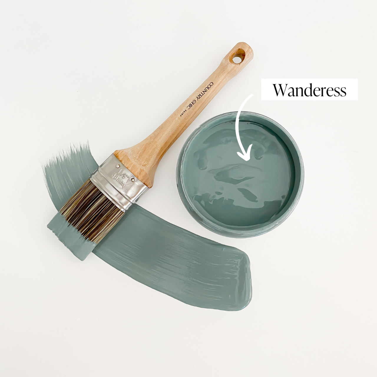 Top view of an open 16oz jar of Country Chic Chalk Style All-In-One Paint in the color Wanderess. Deep sea green.