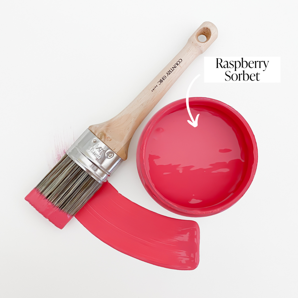 Top view of an open 16oz jar of Country Chic Chalk Style All-In-One Paint in the color Raspberry Sorbet. Deep pink.