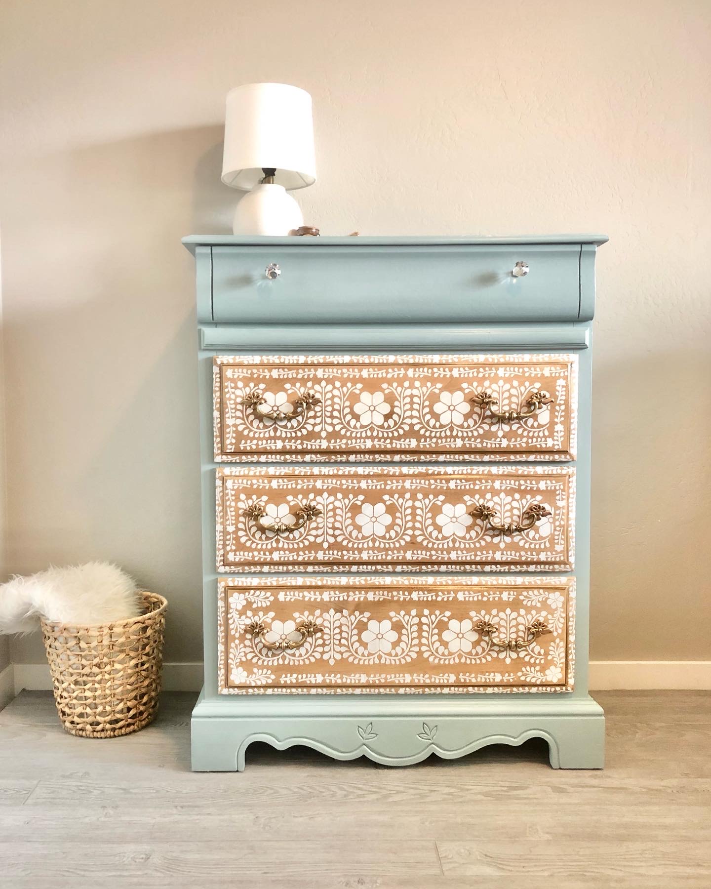 Light blue painted dresser makeover with ornately floral stenciled drawers
