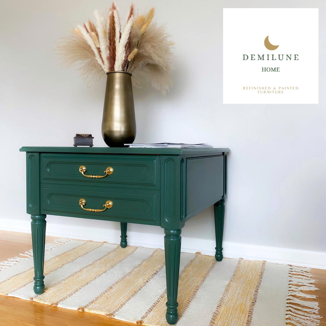 Dark green and gold painted end table with yellow and white striped rug