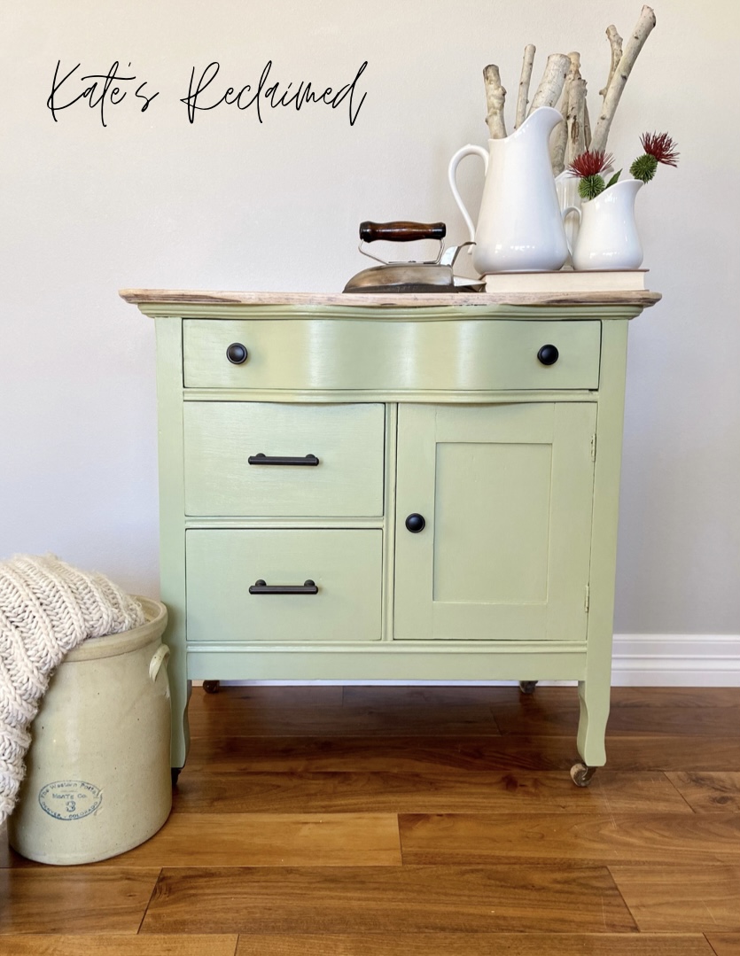 Serpentine antique washstand painted sage green with casters