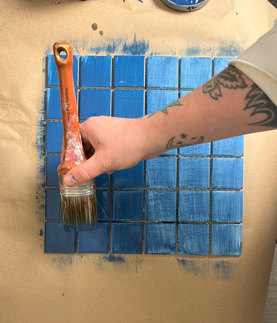 Tile painting second coat of blue paint